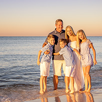 Family on beach shore