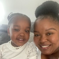 patient emory smiling with mom