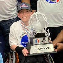 patient holding trophy