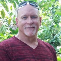 Darrel smiling at camera