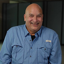 Ruben Vas smiling during interview