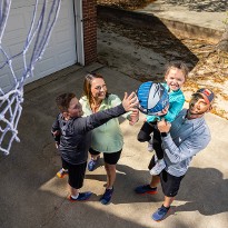 NewStart success stories, the Patranellas, share a moment with their children.