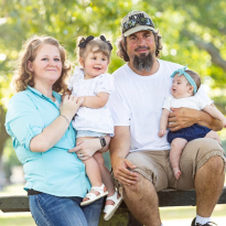 NewStart patient, Cherie Evans, poses with her family.