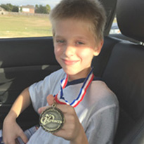 Camden Daniel with medal