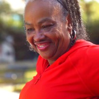 Linda Norah-Davis smiles on while on the TIRR Memorial Hermann campus.