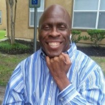 Myford Collins, and Spinal Cord Injury Rehabilitation patient, smiles for the camera.