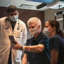 Phil Eaton with doctor and physical therapist at TIRR Memorial Hermann
