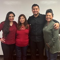 Memorial Hermann Transplant patients, Beltran and McQueen, smile together with their families.