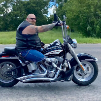 Red Duke Trauma Institute patient, Mathew Craft, rides his motorcycle after recovery.