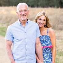 Trauma patient and survivor, Gary, stands proudly with his wife.