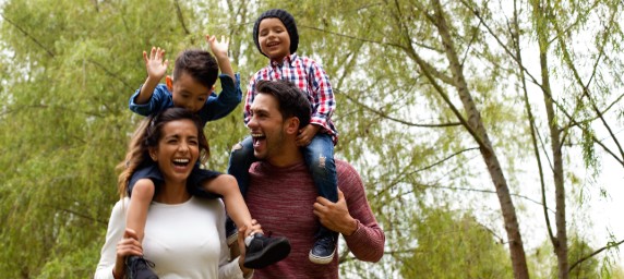 Family walking through the woods