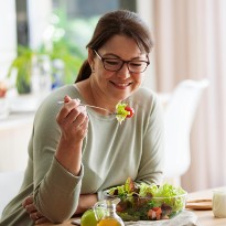 Woman eating salad