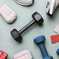 Tennis shoes, hand weights and other workout equipment.