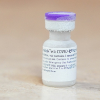 A bottled COVID-19 vaccine fresh from the freezer