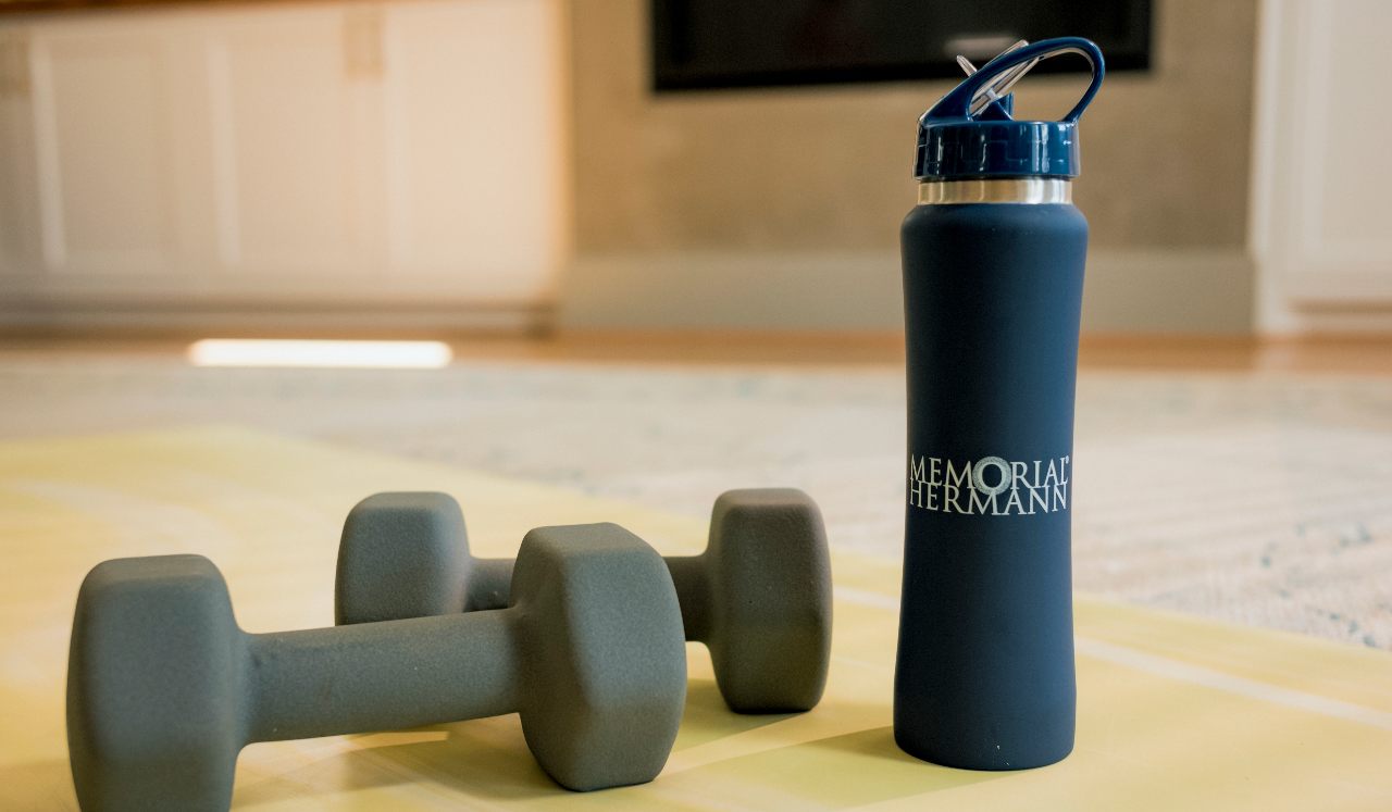 Water bottle next to weights