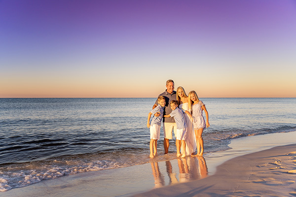Family on beach shore
