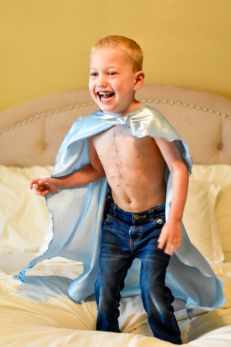 Cason Cox jumping on the bed