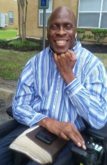 Myford Collins, and Spinal Cord Injury Rehabilitation patient, smiles for the camera.
