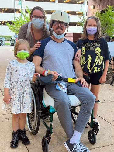 TIRR Memorial Hermann patient, Eric Blumentritt, poses with his family for a photo.