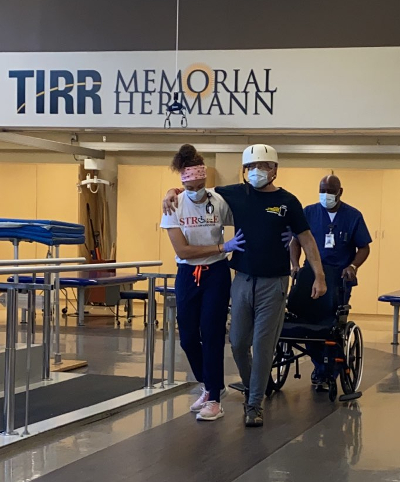 TIRR Memorial Hermann patient, Eric Blumentritt, works with therapists at the track.