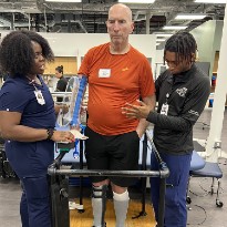 TIRR Memorial Hermann patient, John Eidman, works with physical therapists at TIRR facilities.