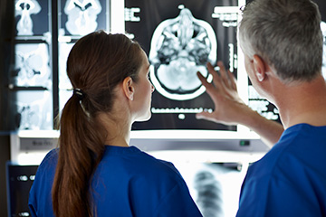 Doctors Examining CT Scan