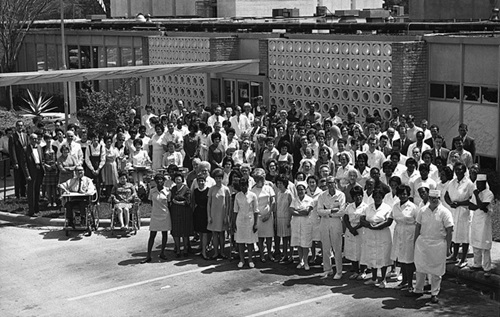 Crowd of people pose for a photo outside TIRR
