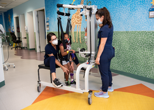 TIRR Memorial Hermann pediatric patient uses assistive technology to stand
