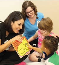 Doctor reading with children