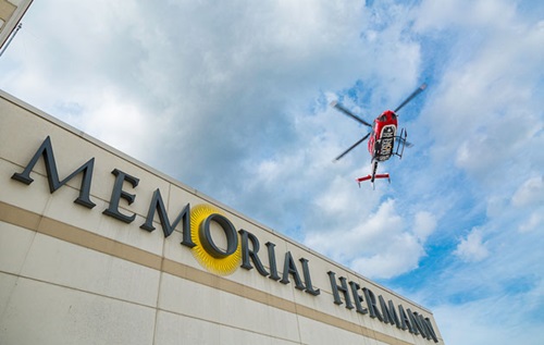 Helicopter flying over Memorial Hermann hospital