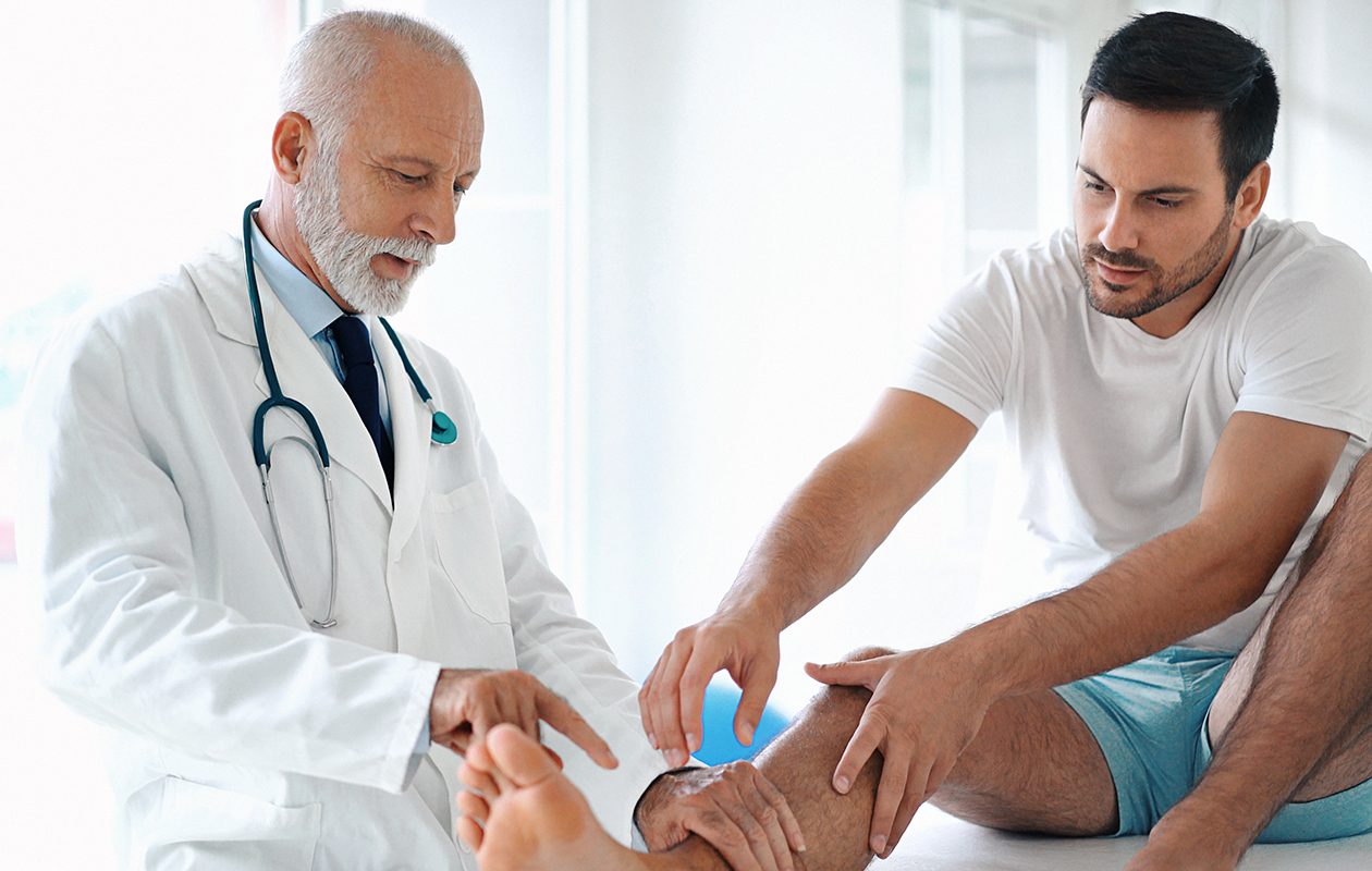 Doctor looking at patient's foot