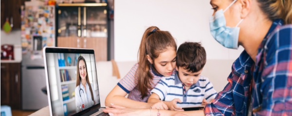 woman and kids on laptop