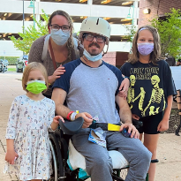 TIRR Memorial Hermann patient, Eric Blumentritt, poses with his family for a photo.