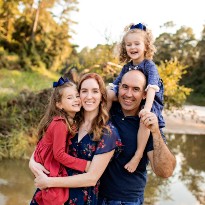 A portrait of Carrie Jobe, a TIRR Memorial Hermann patient, with her daughters and husband.